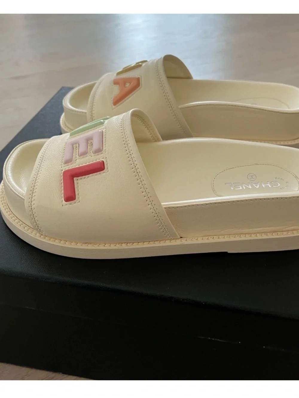 CHANEL Cream Leather Slide Sandals with Pastel Multicolor Logo